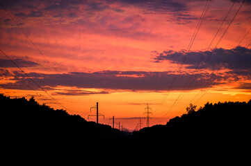 Obraz na płótnie Canvas Sunset in the Electric Transmission Line. Russia, Moscow Region 2020.
