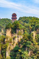 Traditional pagoda among scenic green woods in Avatar Mountains