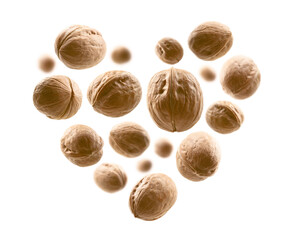 Whole walnuts in the shape of a heart on a white background