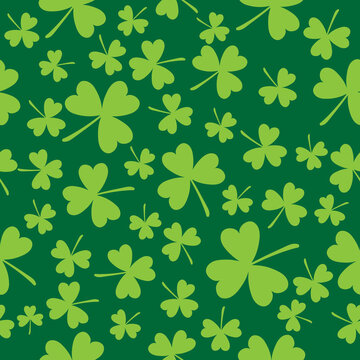Vector seamless background on theme of St. Patrick's Day. Three-leaf clover on green background.