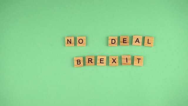 Words no deal brexit. The phrase is laid out in wooden letters. Top view. Motivation
