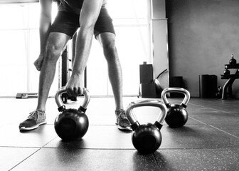 Young  man working out in gym. © Somchai