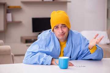 Young man suffering at home