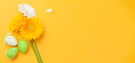 Easter greeting card with gerbera flowers and easter eggs