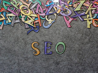 SEO Hand-drawn keyword colorful puzzle with grey background projection view