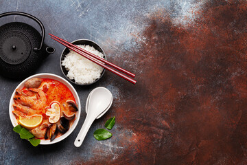 Traditional Thai soup Tom Yum and rice bowl