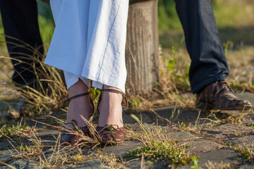 Couple hugging outdoor - close up on feet. High quality photo
