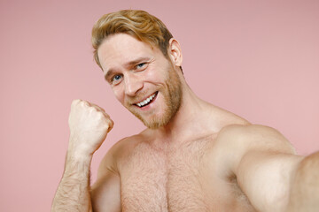 Close up happy bearded naked young man 20s perfect skin doing selfie shot on mobile phone doing...