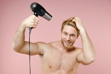 Cheerful handsome bearded naked young man 20s years old perfect skin hold blow dry hair isolated on...