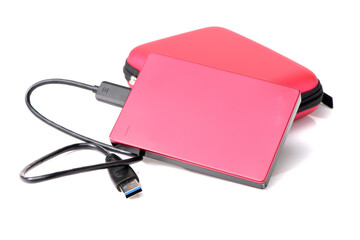 Red external hard drive with usb cable on the white background