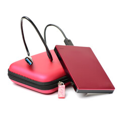 Red external hard drive with usb cable on the white background