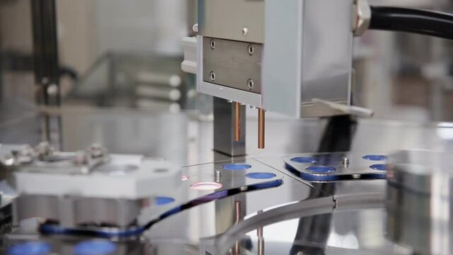 The process of lipstick production in a cosmetics factory. Cosmetic industry.