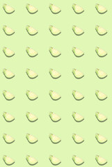 Vertical pattern with fresh white cabbage on a light green background. Cooking template.