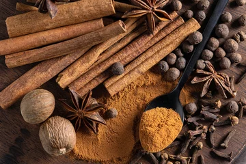  various spices on wooden board © Mara Zemgaliete