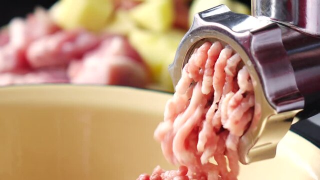 Cooking minced meat in an electric meat grinder from fresh meat at home