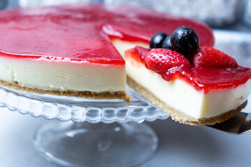 Delicious cheesecake with strawberry and strawberry sauce.