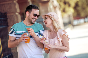 Young couple drinking juice