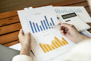 Company finance staff preparing financial documents, company finance staff preparing company...