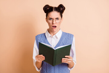 Photo of brunette stressed lady read book wear spectacles white shirt blue vest isolated on beige color background