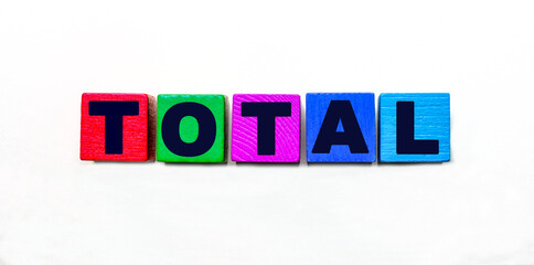 The word TOTAL is written on colorful cubes on a light background