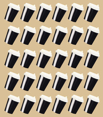 Brown disposable coffee cups on beige background