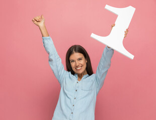casual woman celebrating the fact that she's number one