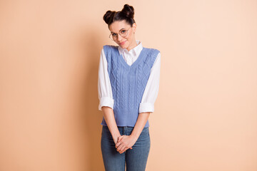 Photo of charming shiny young girl dressed knitted waistcoat arms together rising shoulders...