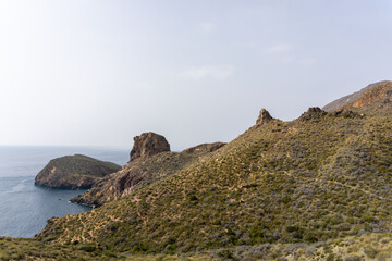 Fototapeta na wymiar wild mountain and hill landscape on the coast of Murcia with cliffs and small secluded coves