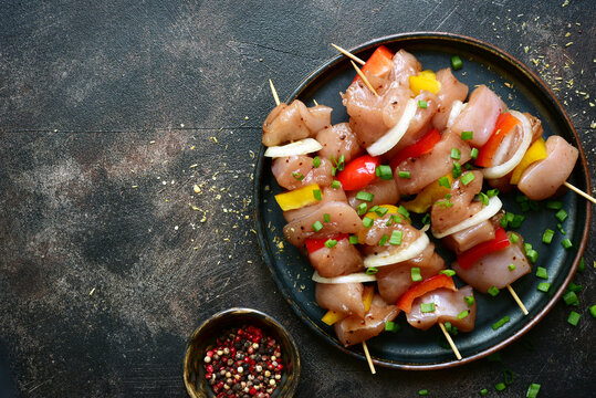 Raw Chicken Kebab With Ingredients For Marinating. Top View With Copy Space.