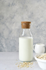 Obraz na płótnie Canvas Organic non dairy oat milk in a bottle