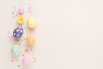 Happy Easter day colorful eggs and flower decoration on paper background with copy space