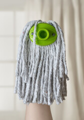 Portrait of a model from a mop head.