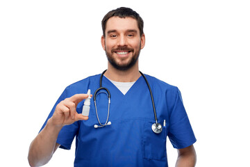 healthcare, profession and medicine concept - happy smiling doctor or male nurse in blue uniform with nasal spray and stethoscope over white background