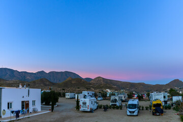 Fototapeta na wymiar modern and busy RV Park in the backcountry of Andalusia at sunset