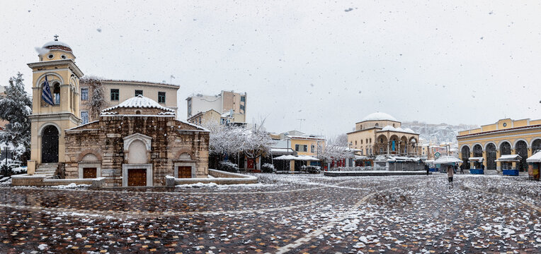 Panorama of the snow covered Monastiraki Square in the center of the old town of Athens, Greece, during a winter day