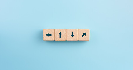 Wooden blocks with arrow many direction arrow choices or move forward. concept solution and start.