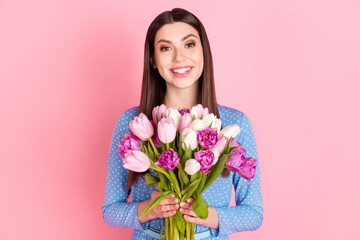 Photo of young excited smiling good mood cheerful woman hold bouquet celebrate women day isolated on pink color background