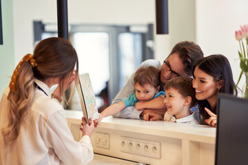 Picture of family checking in hotel