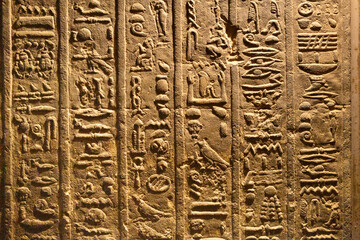 Dendera Temple complex in Egypt. Hieroglypic carvings on wall at the ancient egyptian temple.