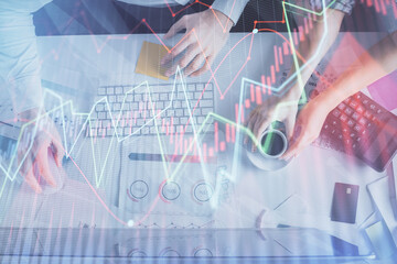 Double exposure of man and woman working together and financial chart hologram drawing. market analysis concept. Computer background. Top View.