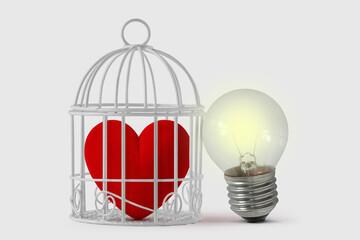 Heart in bird cage with free light bulb - Mind and heart concept