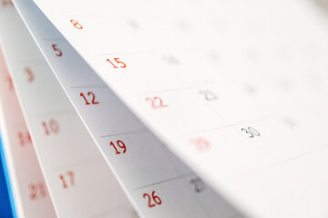 Calendar page flipping sheet close up on office table background business schedule planning...
