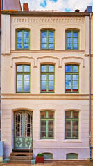 Fototapeta na wymiar Renovated old house with a decorated facade in the old town of Wismar. Germany