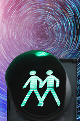 Same sex pedestrian traffic light on the background of star tracks at night time; concept of...