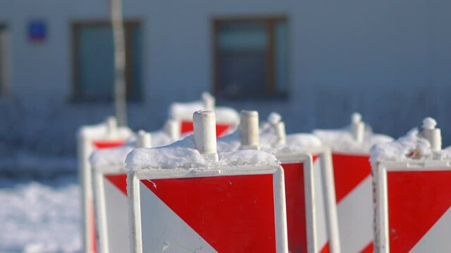 Red-white safety pole post in winter in 4k slow motion 60fps