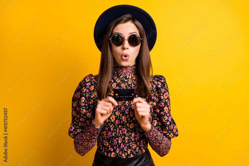 Sticker Portrait of impressed lady arms hold debit card open mouth dark headwear retro outfit isolated on yellow color background