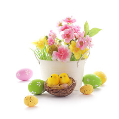 basket with colorful easter eggs and spring flowers isolated on white background - 415752488