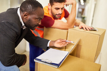 Warehouse clerk and entrepreneur at the tablet computer