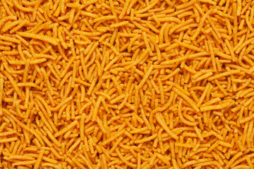 Spicy Aloo Bhujia Full-Frame wallpaper, made with Besan (Chickpeas flour), Red chili and  Potatoes. Indian spicy snacks (Namkeen), Top view angle, 