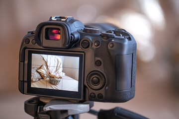 Close up of the screen of a professional digital camera on a tripod while shooting a home...